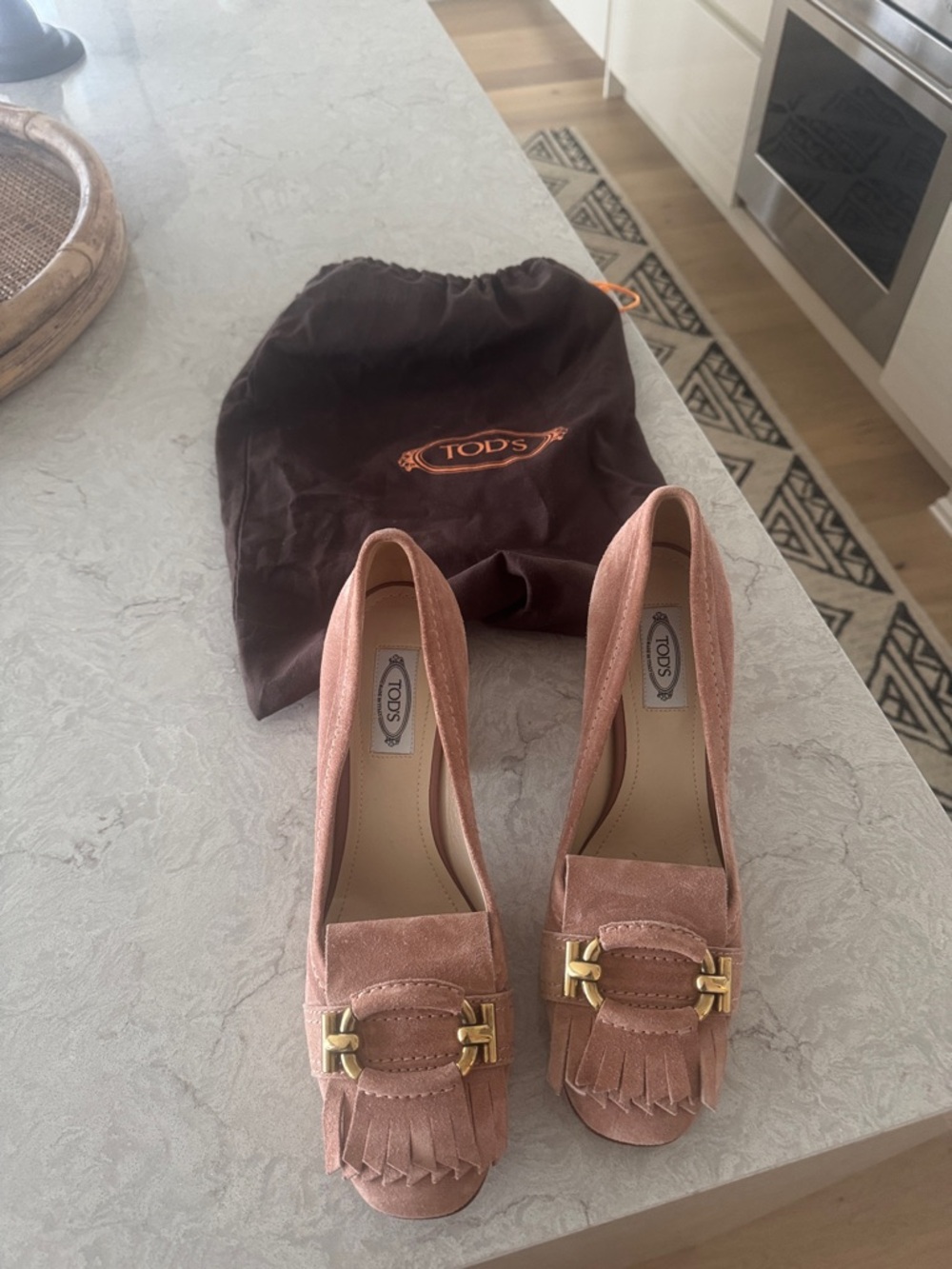 TOD'S Blush Pink Suede Fringe Pumps with Gold Buckle